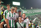 Fans posing for a picture watching Atletico Nacional