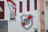 Mural of the river plate badge on a wall
